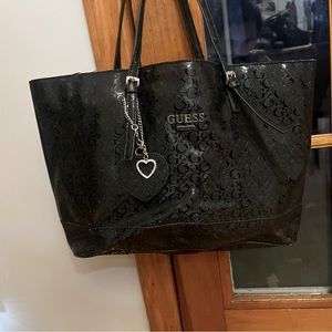 Black large guess purse used little worn on strap